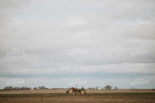 Farmer on Loader Tractor 5396
