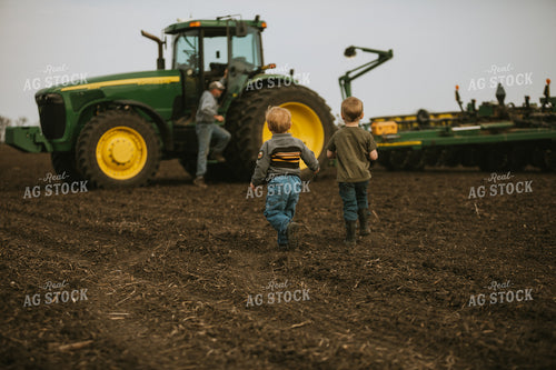 Farm Kids Running to Farmer in Field at Planting 5460