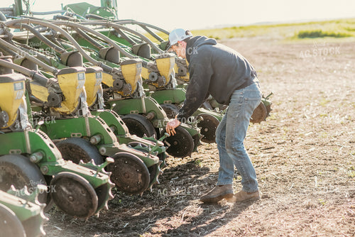 Farmer Working on Planter 64256