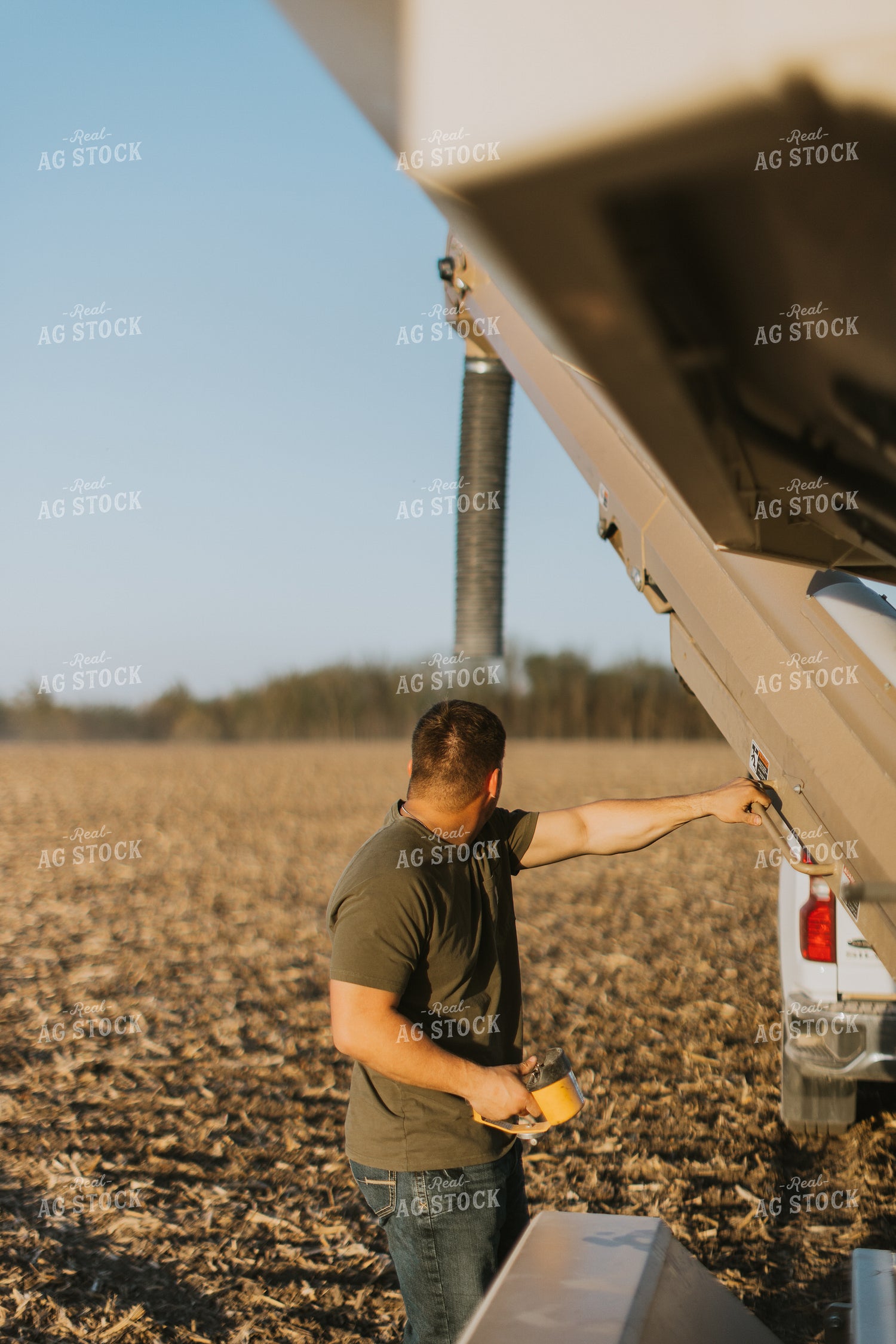 Farmer Prepares Seed Tender in Field 7694