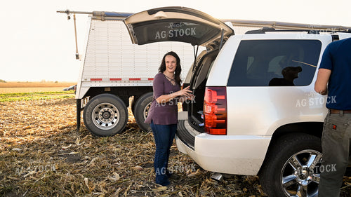 Family Enjoying Harvest Meal in the Field 25789