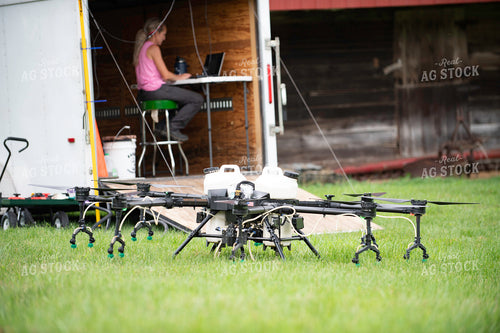 Female Pilot Preparing Drone for Fungicide Application 168065