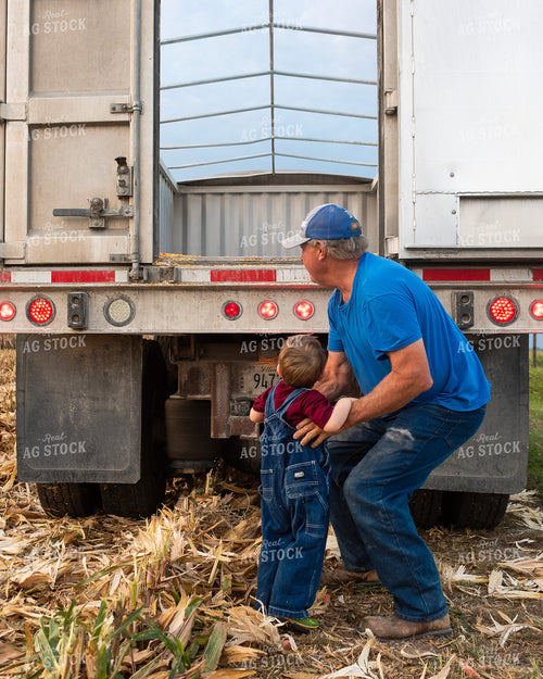 Farmer and Grandson in Field with Semi Truck 129070