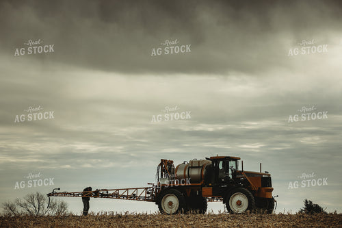 Farmer Checking Sprayer Valves 3650
