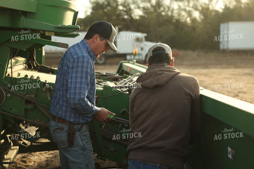 Farmers Fixing Combine 114107