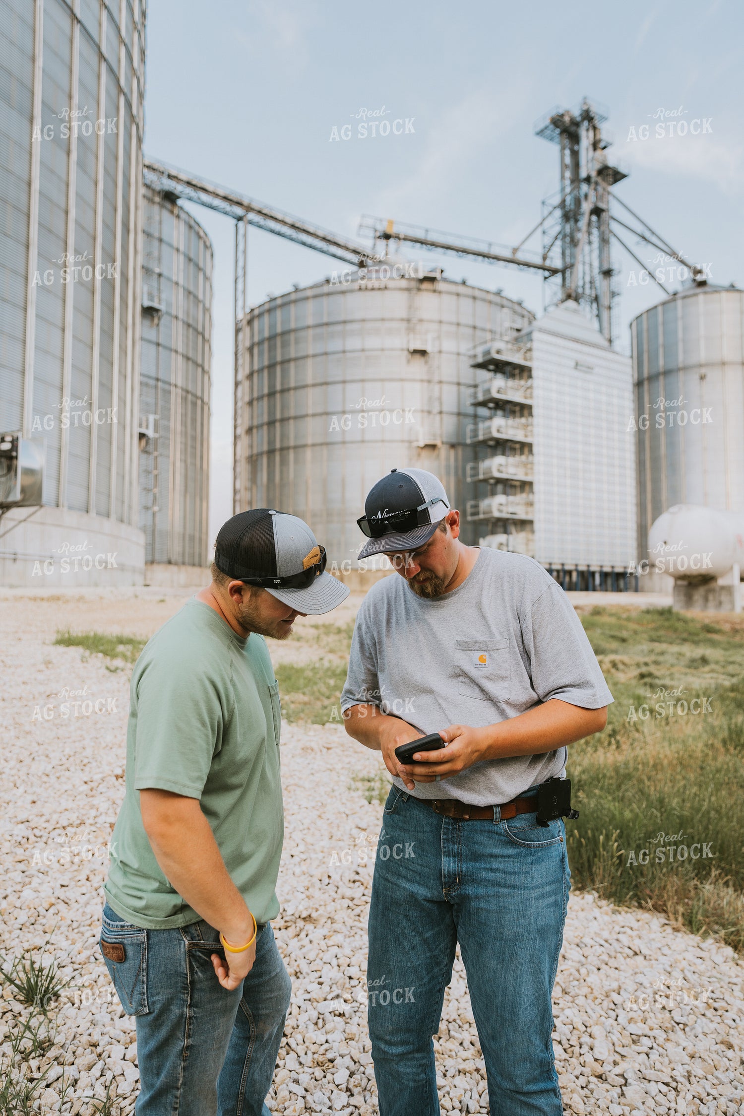 Farmers Talking by Grain Bins 7798