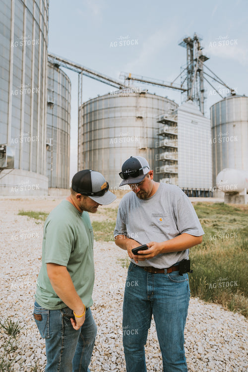 Farmers Talking by Grain Bins 7798