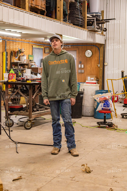 Farmer Fixing Self-Propelled Sprayer 231123