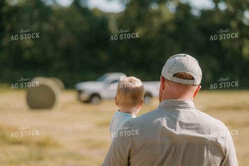 Farmer Checking Crops with Farm Kid 125404