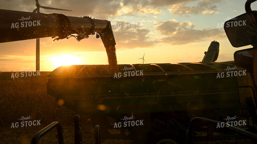 Combine Unloading Corn on the go into an Auger Wagon 25777