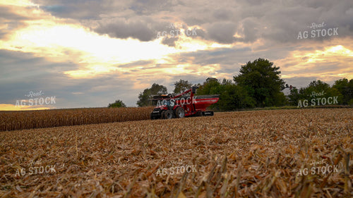 Combine Unloading Corn into Auger Wagon on the Go 25651
