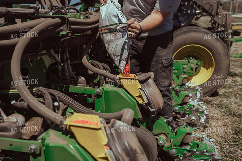 Farmer Filling Planter for Test Plot 196114