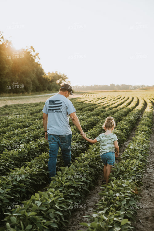 Farmer and Farm Kid Scouting Soybean Field 6265