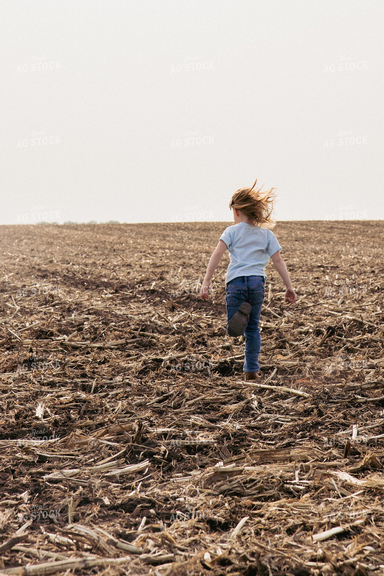 Farm Kid Running in Newly Planted Field 67307