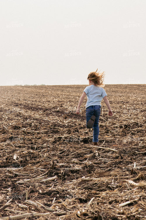 Farm Kid Running in Newly Planted Field 67307
