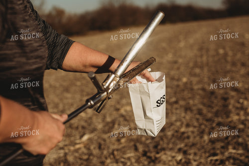 Farmer Opening Soil Sampling Probe with Soil Core 3713