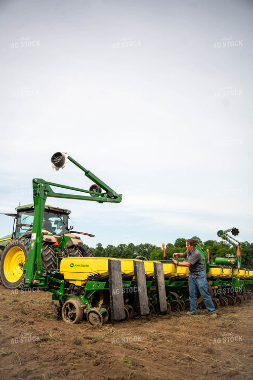 Female Farmer Filling Planter 115646