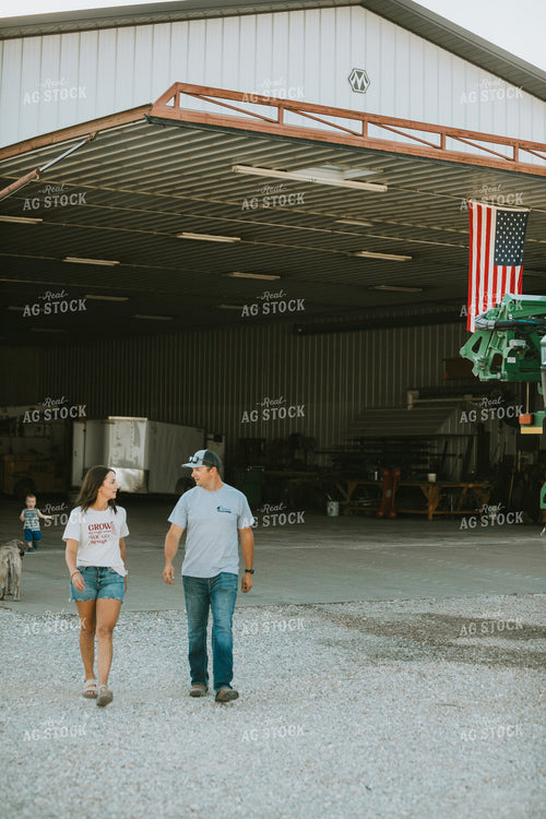 Farmer and Farm Wife Talking Outside Shop 6242