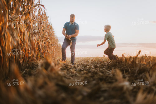 Farmer Checking Corn with Kid 9395