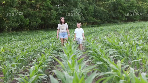 Female Farmer and Son Checking Corn 9168