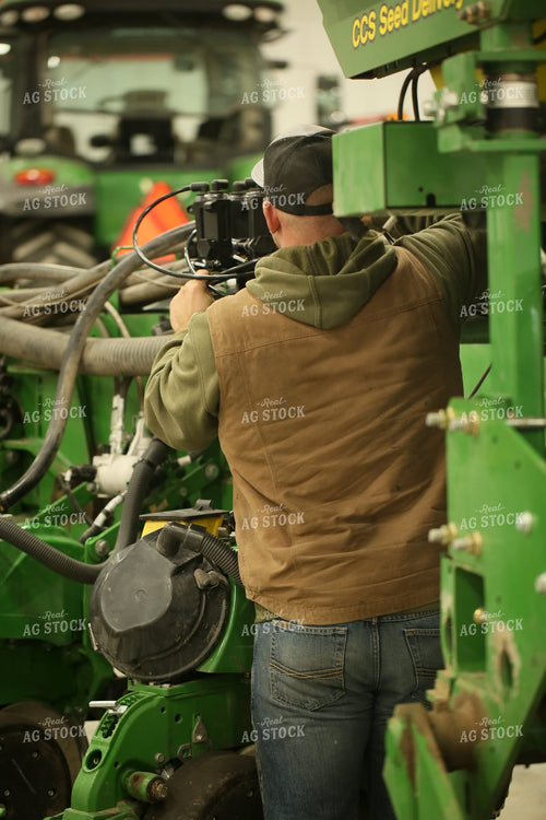 Farmer Fixing Planter 161143