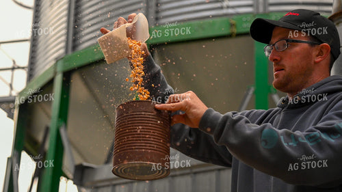 Farmer Testing Corn Moisture On-farm Storage 25621