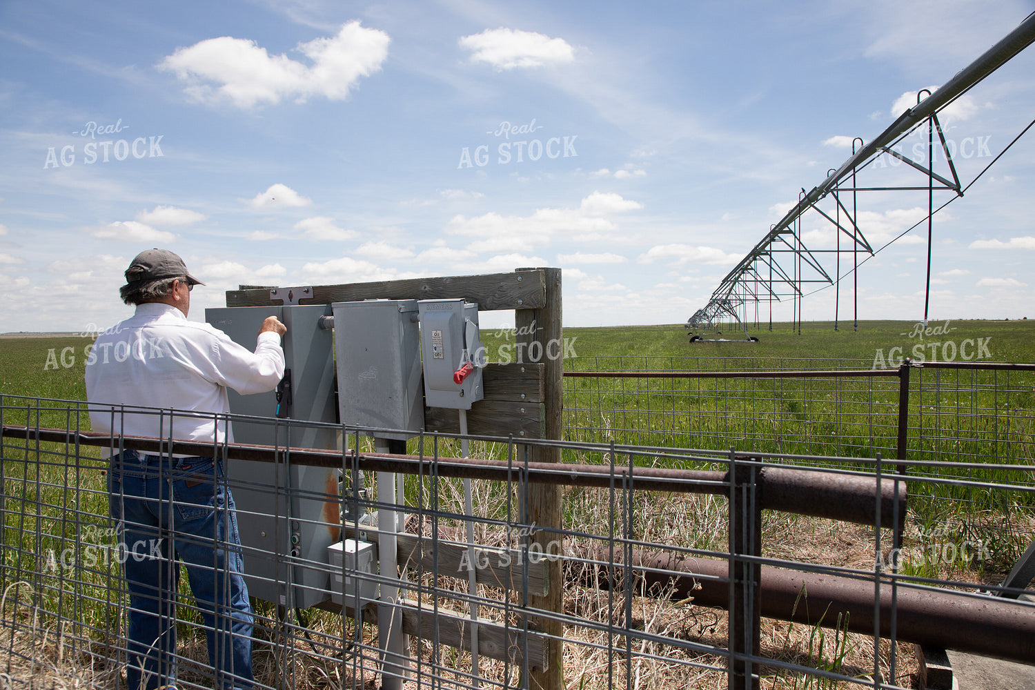 Farmer Checking Pivots 117054
