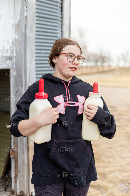 Farm Kid Carrying Calf Bottles 155377