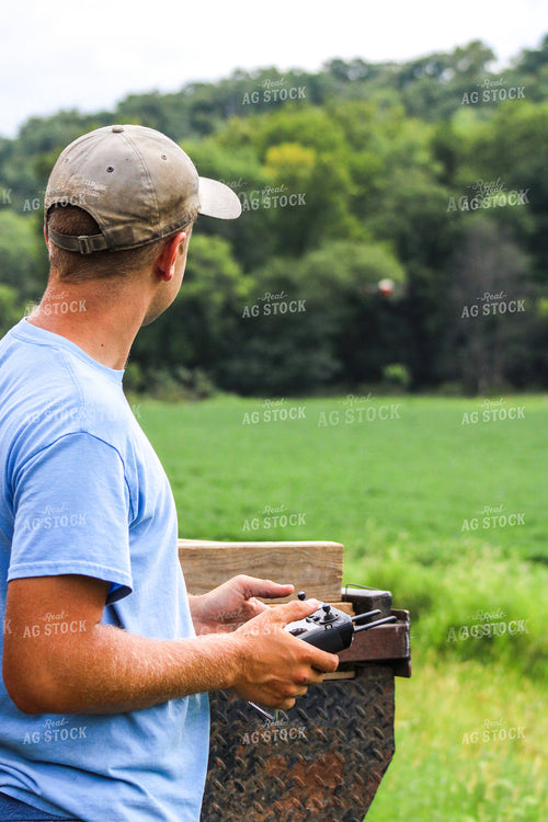 Farmer Holding Drone Remote 101017