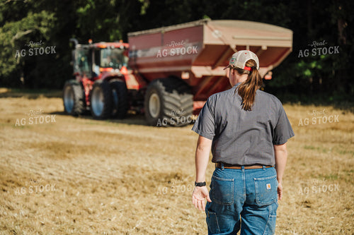 Female Farmer Walking by Tractor 115215