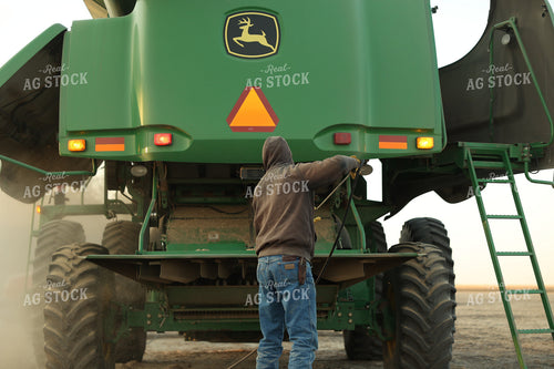 Farmer Blowing out Combine 114097