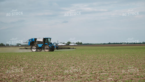 New Holland Self-Propelled Sprayer Applying Crop Protection to Early-Season Field 401041