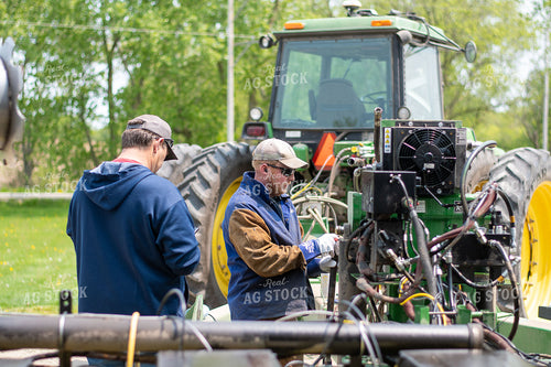 Farmers Repairing Hydraulic Oil Cooler Fan and PTO Pump Mounted on Planter 50364