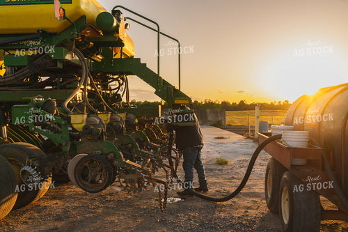 Farmer Working on Planter 128022