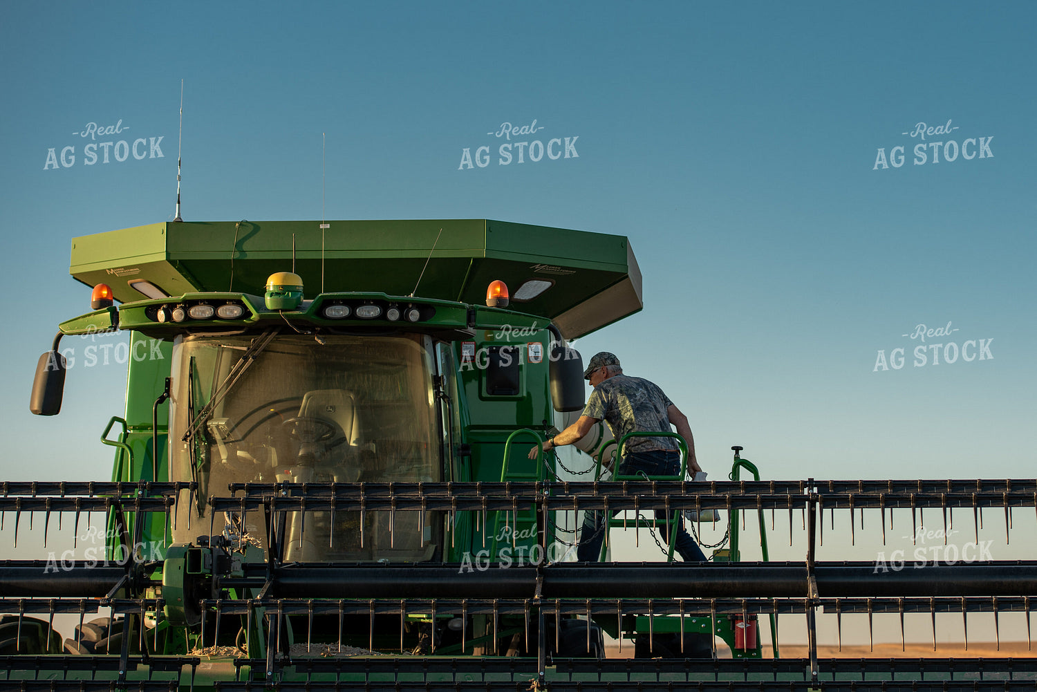 Farmer Climbing into Combine 274036