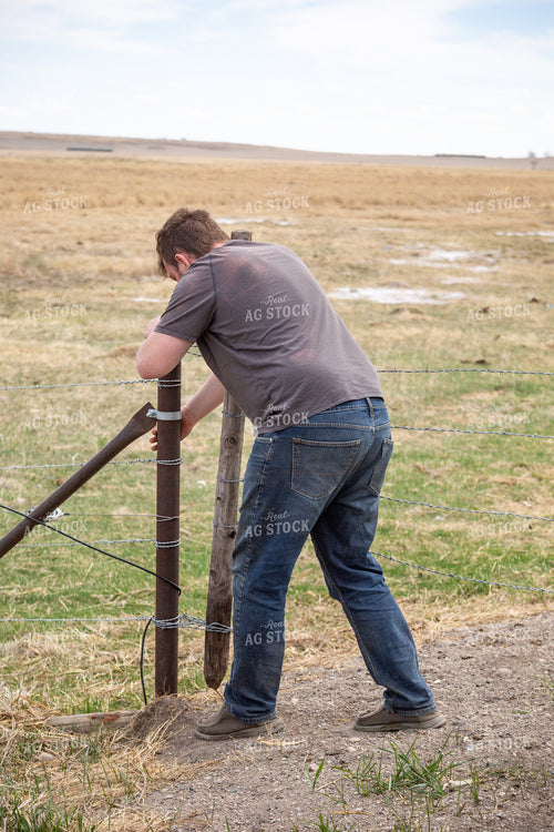 Farmer Putting Up Fence 155417