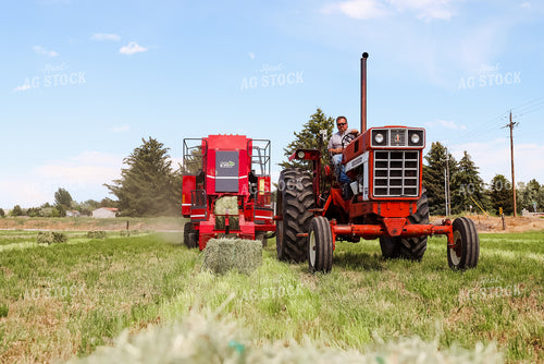 Tractor Baling Hay 83043