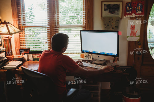 Farmer in Farm Office on Computer 4444