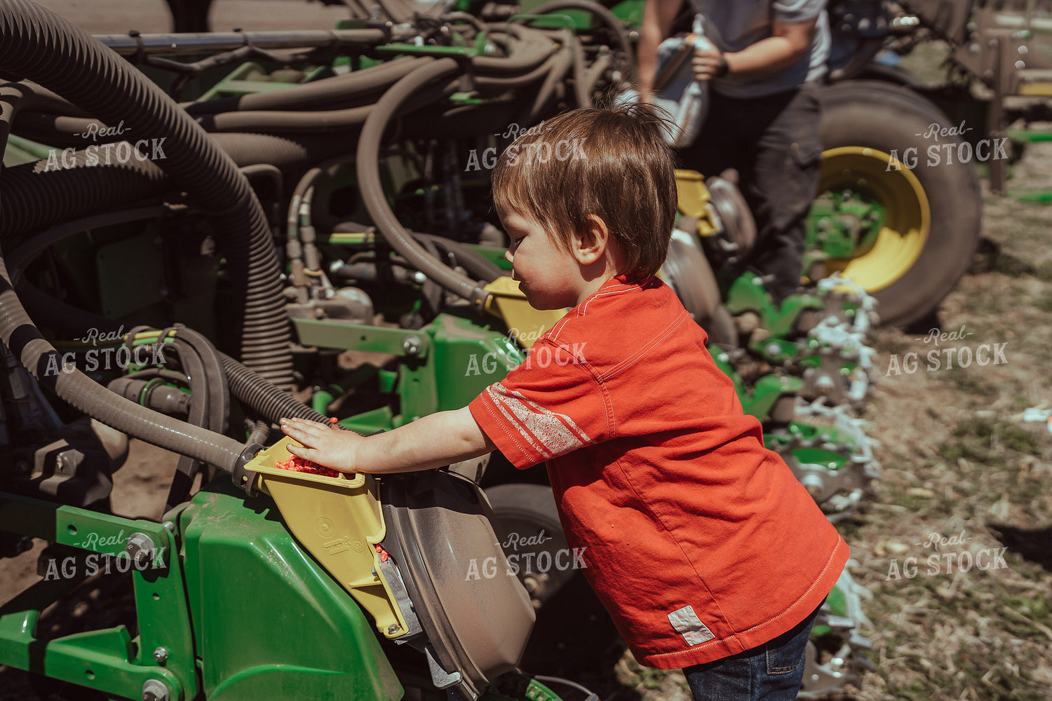 Farm Kid Helps with Test Plot 196115