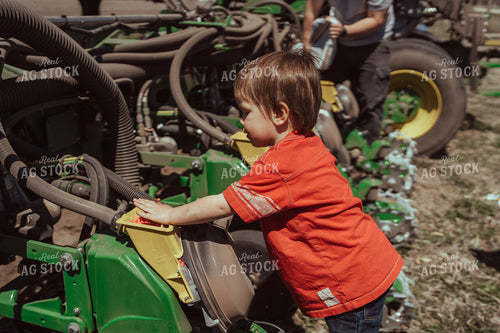 Farm Kid Helps with Test Plot 196115
