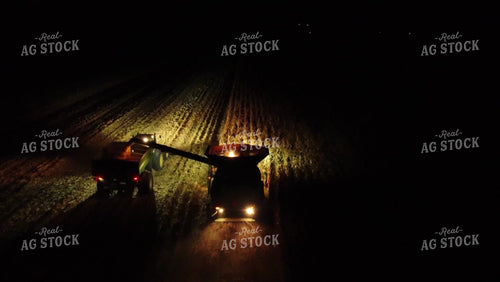 Aerial of Corn Harvest Combine Unloading at Dark 52585