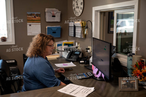 Female Farmer Working on Computer 115530