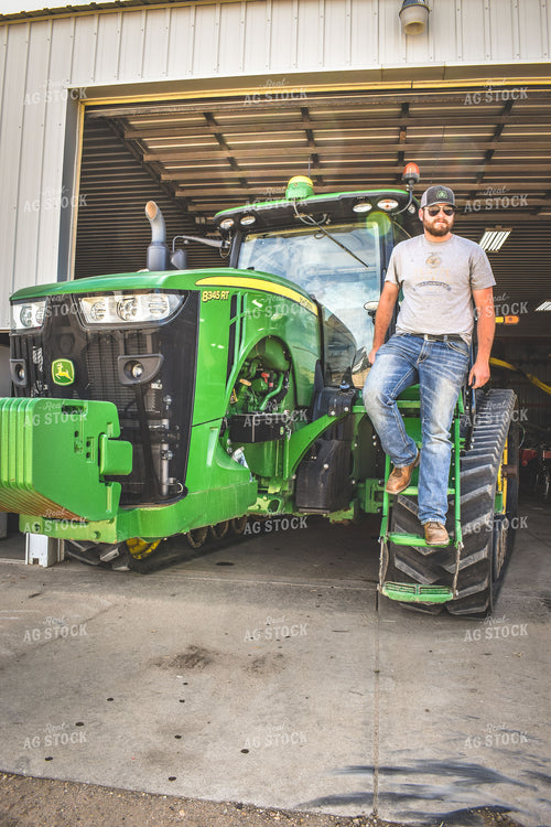 Farmer Climbing Out of Tractor 56163