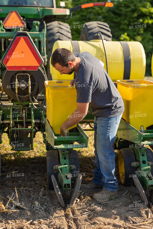Farmer Dumping Seed Box 104019