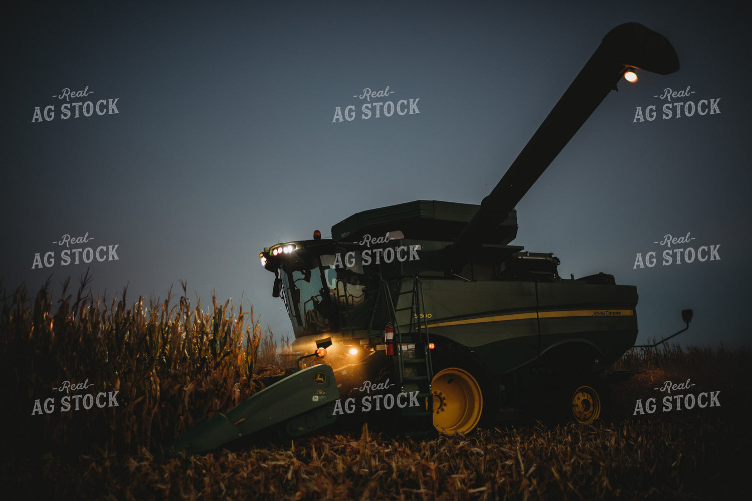 Combine Picking Corn with Lights On at Dusk 3406