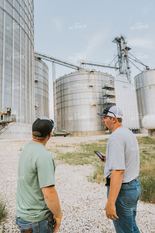 Farmers Talking by Grain Bins 7796