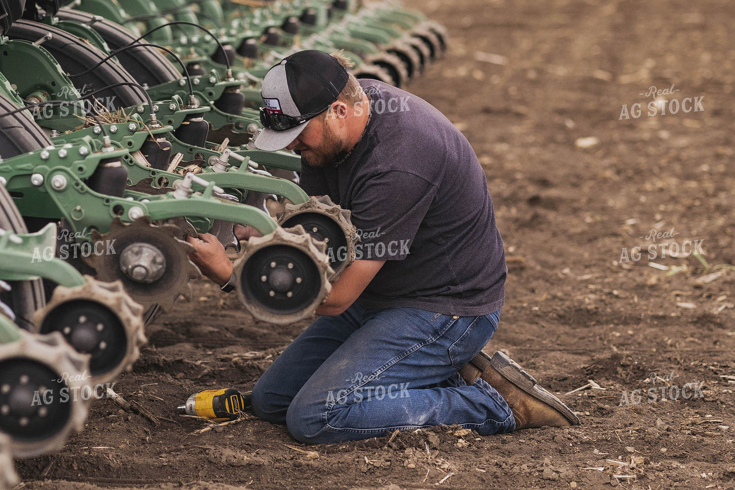 Farmer Repairing Planter 91008