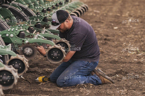 Farmer Repairing Planter 91008