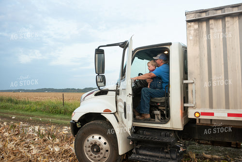 Farmer and Grandson in Field with Semi Truck 129074