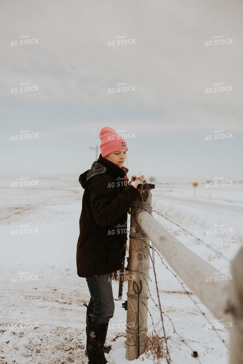Female Rancher Working on Fence 61199